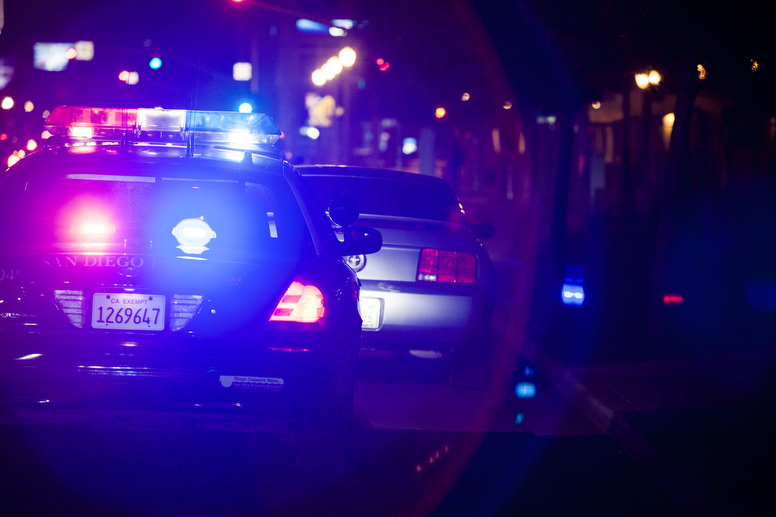 Image result for police car pulling someone over at night